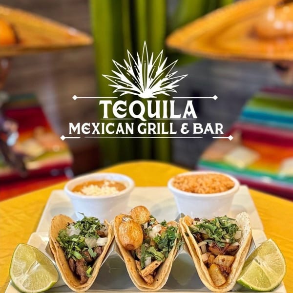 Three Tequila Mexican Grill & Bar tacos with lime wedges, refried beans, and rice.